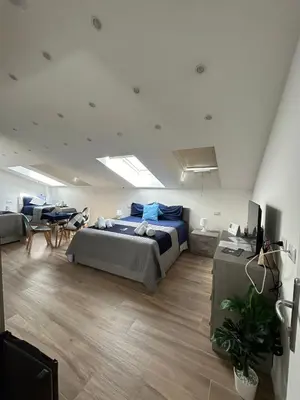 Letto o letti in una camera di GIULY SUITES & ROOMS
