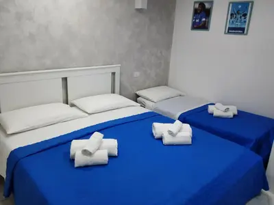 Letto o letti in una camera di DIMORA MARADONA ai QUARTIERI SPAGN0LI