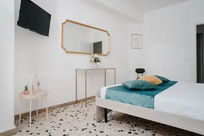 Letto o letti in una camera di Il Cortile by Vista Napoli