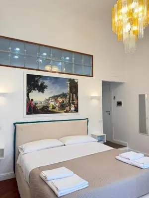 Letto o letti in una camera di La Canzonetta Affittacamere