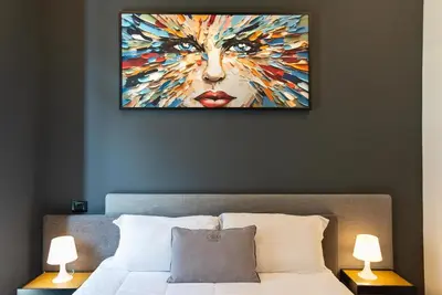 Letto o letti in una camera di Gram Suites