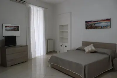 Letto o letti in una camera di O CORE E NAPULE