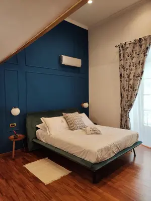 Letto o letti in una camera di Palazzo il Convento Universita