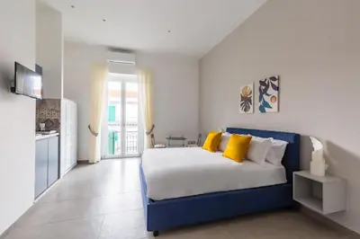 Letto o letti in una camera di Maria's Bright Flats at the Cathedral by Wonderful Italy
