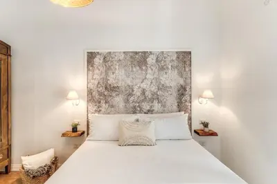 Letto o letti in una camera di Annamaria Rooms