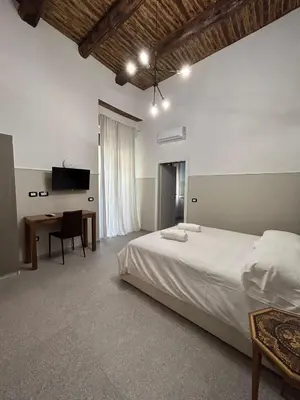 Letto o letti in una camera di La Suite del Centro Storico