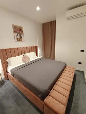 Letto o letti in una camera di Babylon Luxury Suite & Apartments