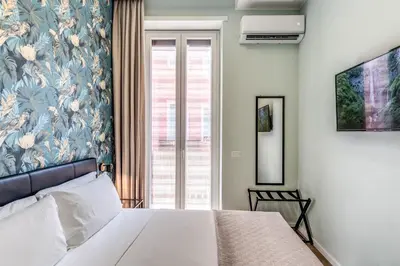Letto o letti in una camera di Gravina8 - Rooms in Naples