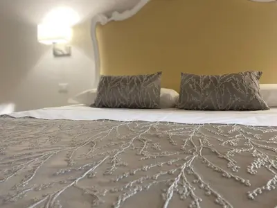 Letto o letti in una camera di MILUAR Luxury B&B - Vanvitelli