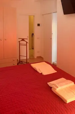 Letto o letti in una camera di B&B Bibliotechina