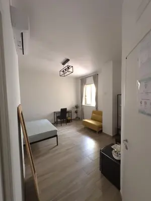 Letto o letti in una camera di Le camere del Nonno Luigi