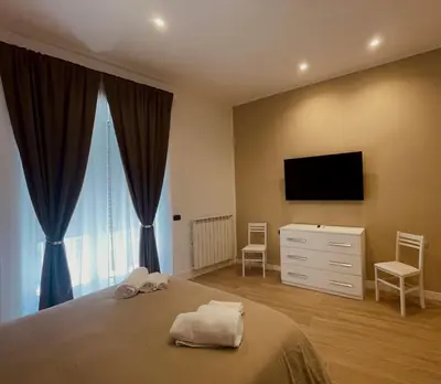 Letto o letti in una camera di La Suite di Dante Napoli