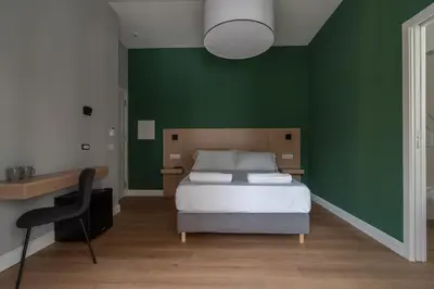 Letto o letti in una camera di Nolana 28 Rooms in Naples