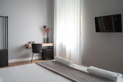 TV o dispositivi per l'intrattenimento presso Nolana 28 Rooms in Naples