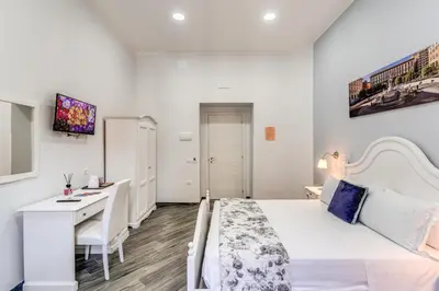 Letto o letti in una camera di Agorà Borsa