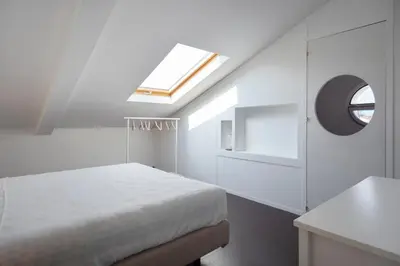Letto o letti in una camera di La Camera Chiara - Mansarda in Via Duomo