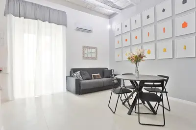Area soggiorno di GuestHost - Suite I Miracoli Central Apartment