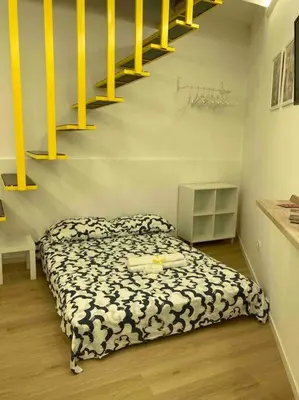 Letto o letti in una camera di Ricomincio da 3 - La tua casa nel cuore di Napoli