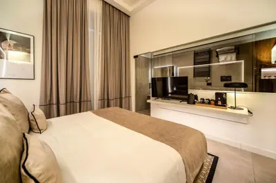 Letto o letti in una camera di MAMALU - Studios and Suites