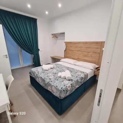 Letto o letti in una camera di Residenza Nascari al Plebiscito