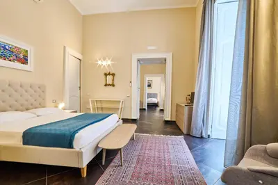 Letto o letti in una camera di Via Niccolò Tommaseo 14