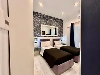 Letto o letti in una camera di Elegance Rooms Spaccanapoli