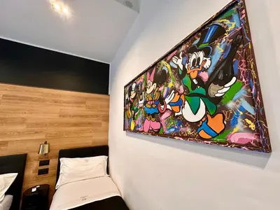 Letto o letti in una camera di Elegance Rooms Spaccanapoli