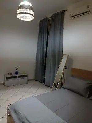 Letto o letti in una camera di Espy Naples