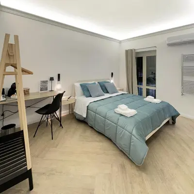 Letto o letti in una camera di VICKI Vomero Rooms - Napoli
