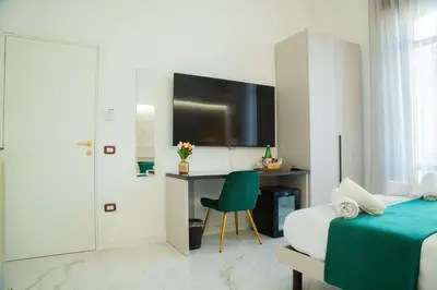 Letto o letti in una camera di Lagi Suites