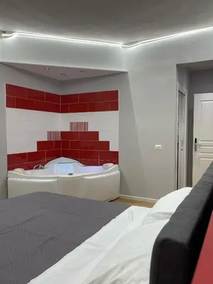 Letto o letti in una camera di Vomero Suite and Deluxe Room B&B Napoli