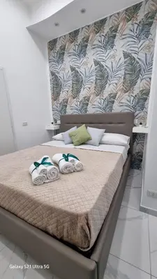Letto o letti in una camera di San Petrillo APARTMENT