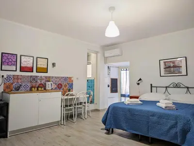 Letto o letti in una camera di La Sartoria - Casetta napoletana
