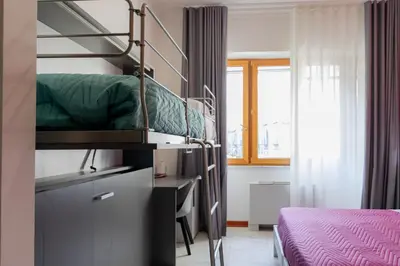 Letto o letti in una camera di May Flower Luxury