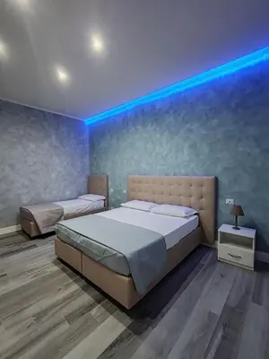 Letto o letti in una camera di Gioia Toledo