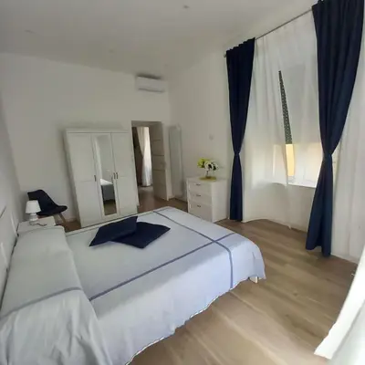 Letto o letti in una camera di Nonna Assunta