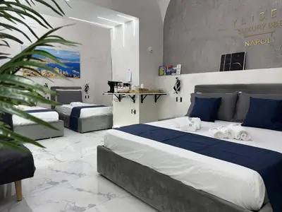 Letto o letti in una camera di Ylisea Luxury B&B
