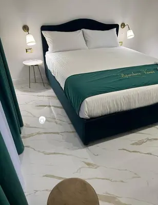 Letto o letti in una camera di Depandance Vania Napoli