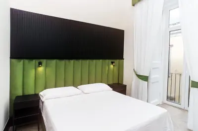 Letto o letti in una camera di FiDa Rooms
