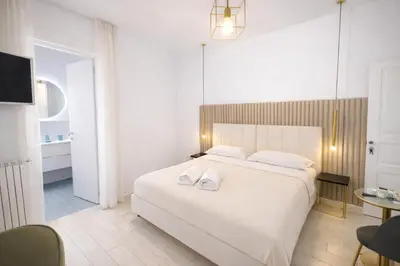 Letto o letti in una camera di VomeRooms