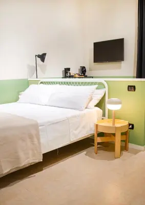 Letto o letti in una camera di B&B Capriccio Napoli