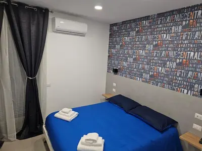 Letto o letti in una camera di B&B Napoli Mitologica