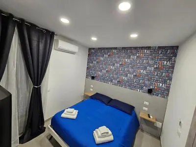 Letto o letti in una camera di B&B Napoli Mitologica