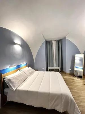 Letto o letti in una camera di Nel Vico