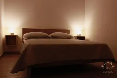 Letto o letti in una camera di Antico Borgo Rooms