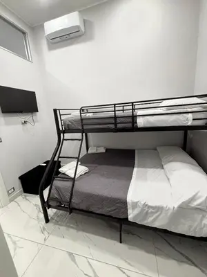 Letto o letti in una camera di Masaniellohouse