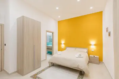 Letto o letti in una camera di O' Munasterio e Santa Chiara