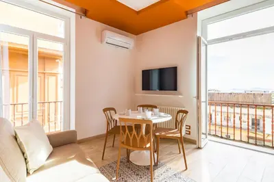 TV o dispositivi per l'intrattenimento presso Colonna Apartments by Wonderful Italy