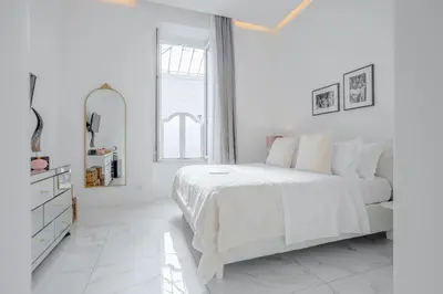 Letto o letti in una camera di La Corte dei Mille Luxury