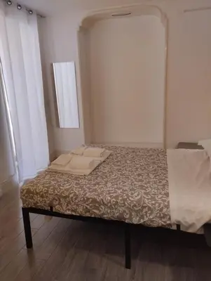 Letto o letti in una camera di Residence e appartamenti Cavallerizza